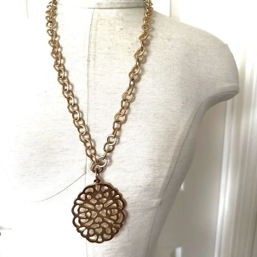 Large gold tone heart design pendant necklace